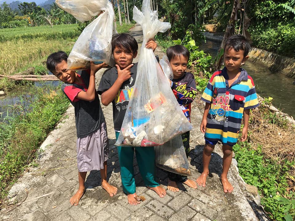 children collecting waste